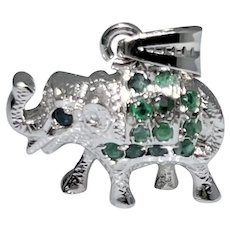 Cute sterling silver Elephant pendant with faceted natural Emeralds