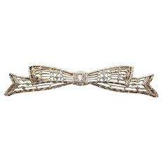 Early Art Deco 14 Karat White Gold Filigree Diamond Bow Pin
