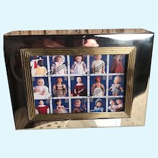 Photo frame with antique and collectible post office dolls on front